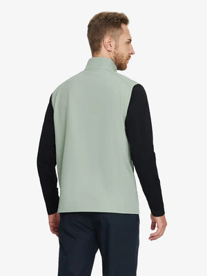 Back view of the light green windproof golf vest, highlighting its vibrant color and functional zippered pockets.