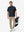 Full body model holding golf equipment, lightweight upf50+ short sleeve golf vests jacket in dark grey