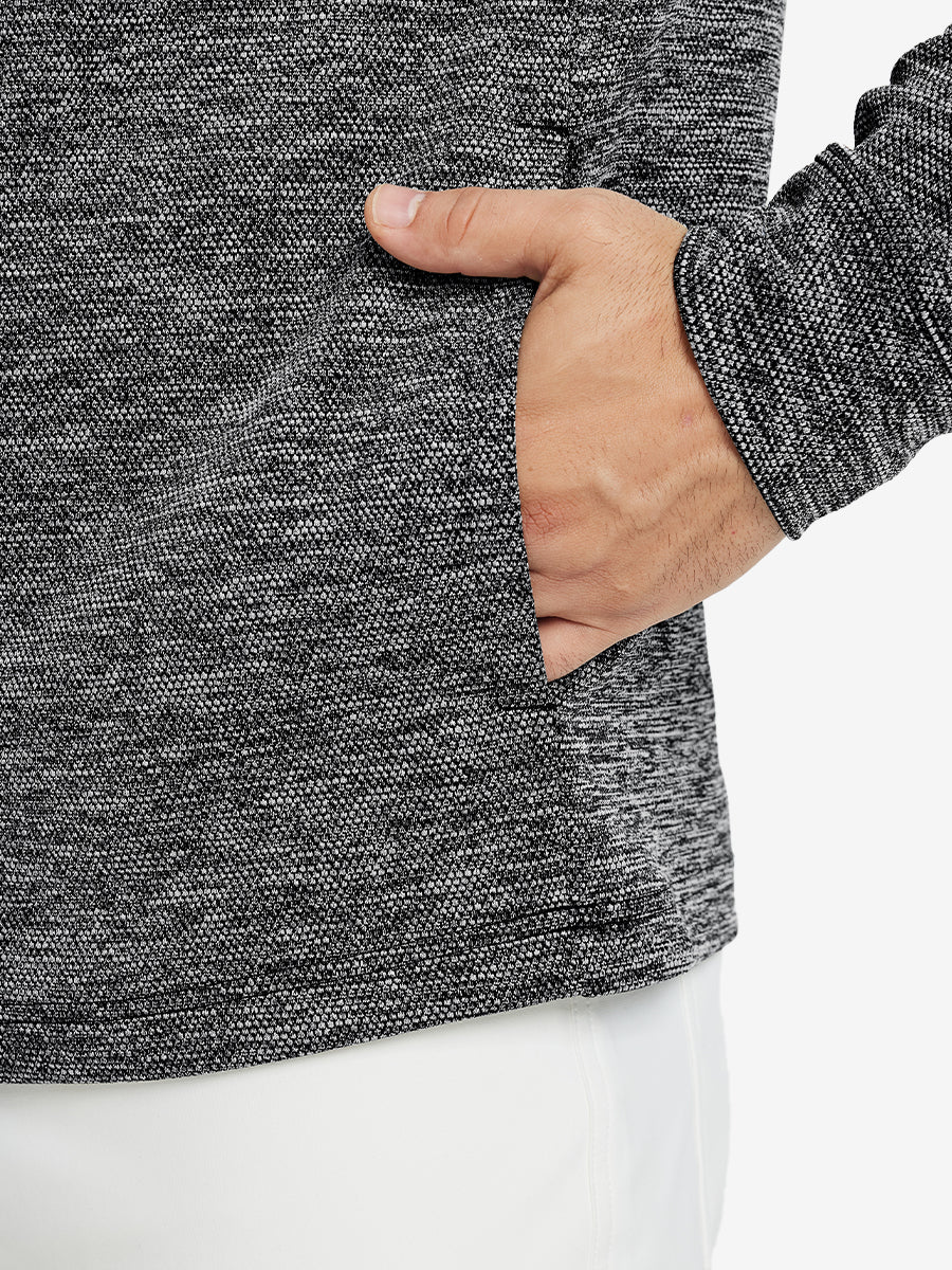 Close-up of pocket detail, single hand inside texture solid hoodies pullover, casual style in black heather.