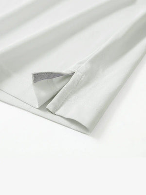 Detail shot of hem opening on CREAM Ventilated Pique Performance Polo