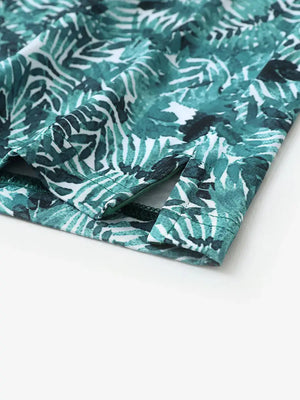 Detailed shot of side hem slit on DARK GREEN LEAF polo for all-day comfort and stretch