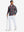 Full body model holding a golf club, wearing full print lightweight quarter zip pullover in redblack check