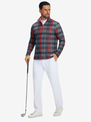 Full body model holding a golf club, wearing full print lightweight quarter zip pullover in redblack check