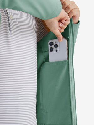 Close-up of the front side pocket detail on kids soft lightweight fleece lined jacket in dusty green, showing quality stitching.