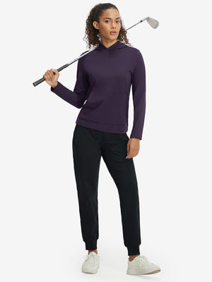 Model holding golf club, dressed in women's lightweight hoodies pullover in dark purple.