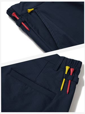 Waistband detail of lightweight flat front casual trousers in navy, showing clean stitching.