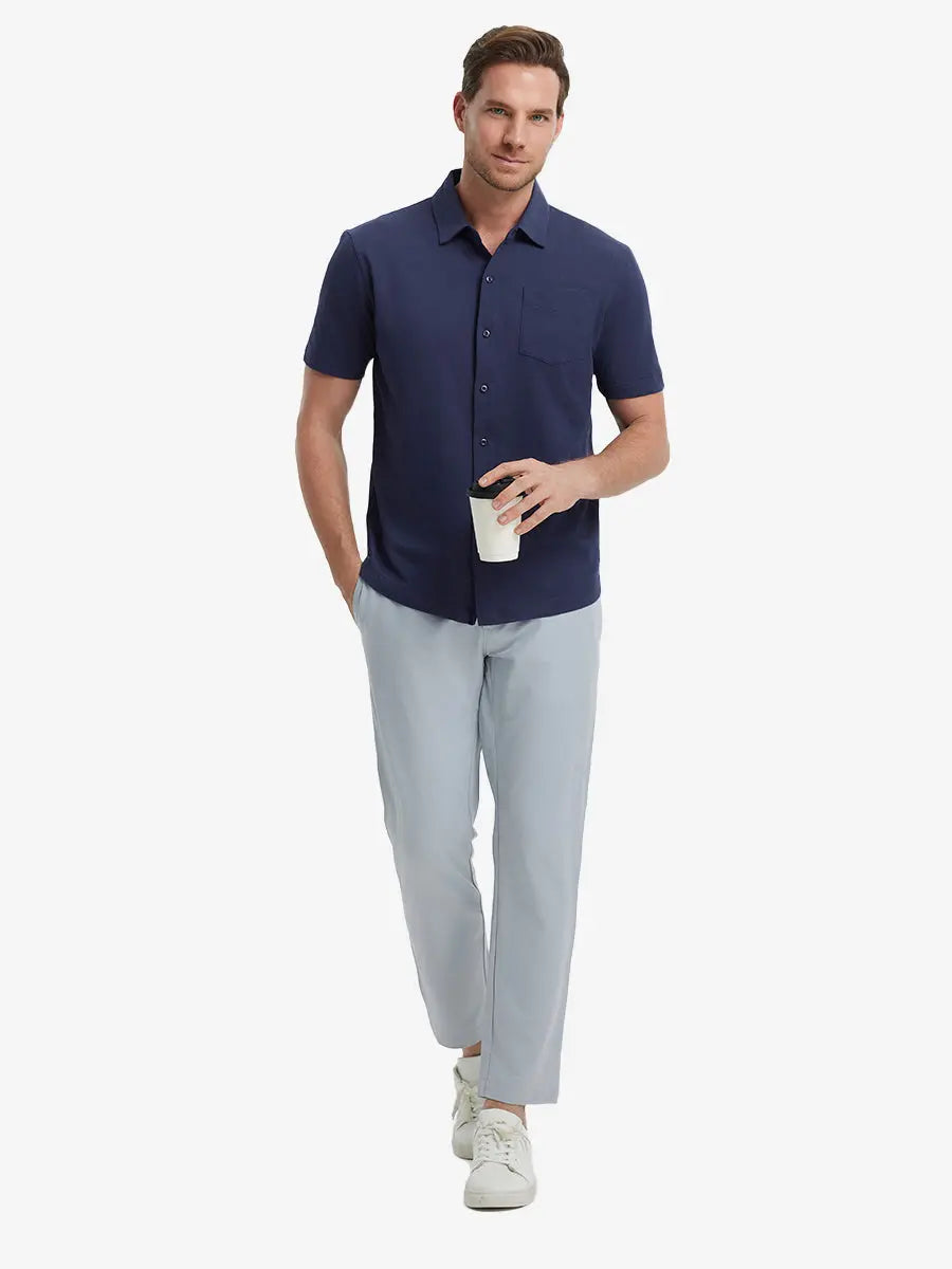 Full-body view of model holding takeaway drink cup in NAVY Cotton Blend Plain Shirt.