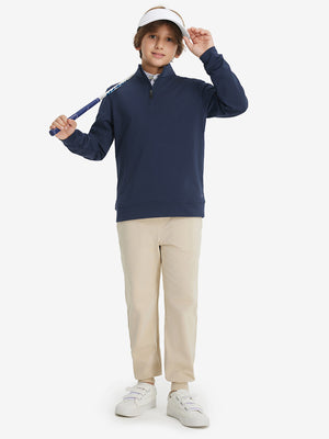 Full body model holding a golf club, styled in youth winter micro-fleece quarter zip pullover with navy