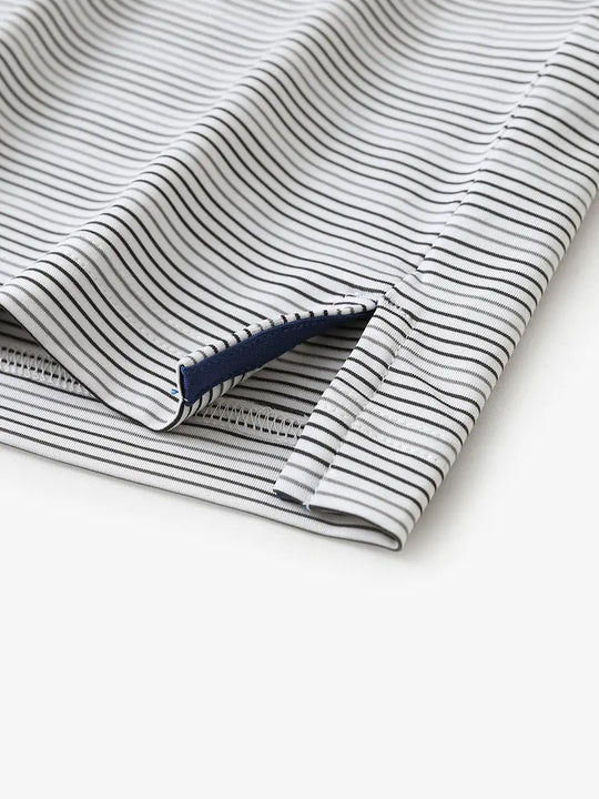 Close-up of side hem slit on Dark Grey Neutral Grey Performance Stripe Golf Shirt
