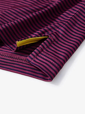 Side slit detail of MAROON STRIPE shirt, showcasing hem design and craftsmanship