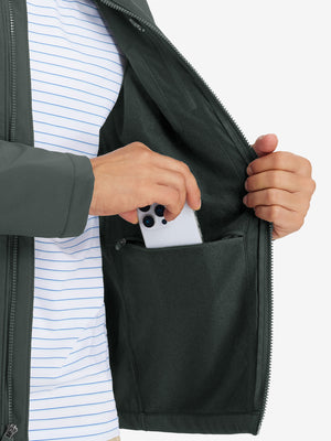 Close-up of winter thermal outdoor water resistant fleece jacket pocket holding a phone, practical detail in grey