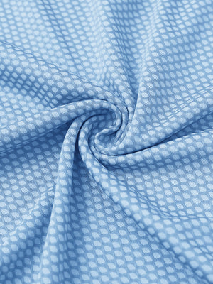 Close-up of light blue your favorite jacquard polo fabric showing textured knit and soft finish.