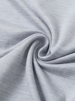 Close-up fabric detail of skin-friendly long sleeve melange polo, soft blend texture with faded denim heather tone