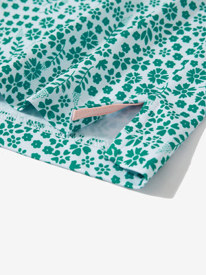 Detail: hem slit of white green florals  stretch printed collarless henley golf shirts