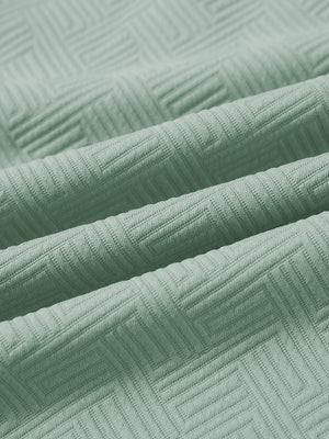 Close-up of fabric on texture solid hoodies pullover, showing texture and finish in beryl green