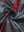 Full print lightweight quarter zip pullover, close-up of smooth fabric with detailed print in redblack check