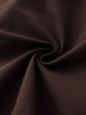 Fabric detail of 4-way stretch performance solid shorts with flexible feel in dark brown