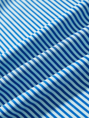 Texture close-up of Kids stripe golf polos with soft fabric and bright aqua stripe stripes