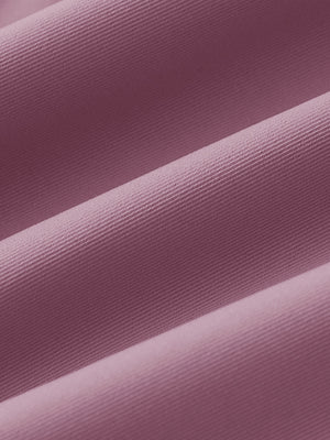 Fabric close-up of Women's 7/8 ankle golf track pants with soft texture in pink