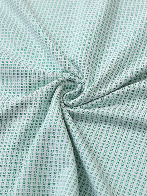 Close-up of emerald elegant performance jacquard polo fabric showing refined texture and subtle pattern.