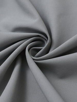 Fabric detail of Windproof golf vests with zip pockets showing smooth texture in light grey