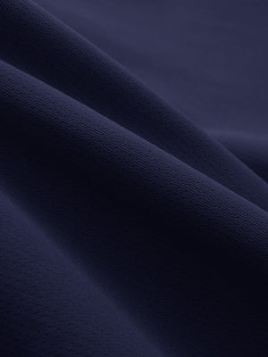 Close-up texture of navy breathable running shorts with 4 zipper pockets fabric showing weave detail