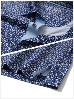 Hem detail of Performance quick dry print golf polos with neat stitching and navy white floral finish