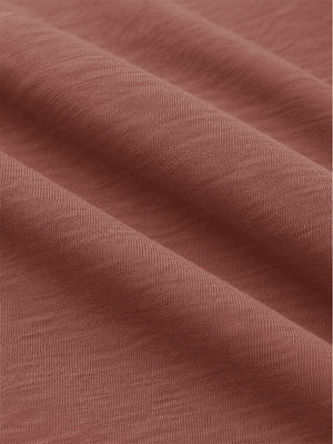 Close-up shot of soft heather knit fabric and fine textile texture, heather midlayer golf hoodies in red ochre heather