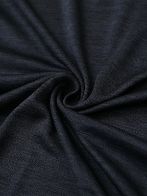 Close-up of black heather modern fit melange polo fabric showing soft and textured surface.