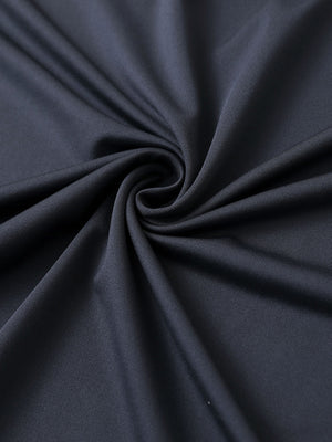 Close-up of dark grey chest print polo shirt fabric showing smooth texture and crisp graphic application area.
