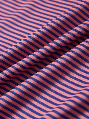Close-up of pink blue stripe stcooling stripe golf shirt fabric showing breathable texture and moisture-wicking stripes.