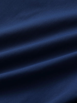 Close-up of blue indigo water resistant everyday pants fabric showing durable texture and protective finish.