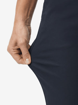 Detail view of stretch fabric on navy women's regular fit stretchy golf pants