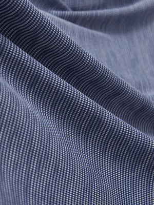 Close-up of light dark blue grid ultra-light quick dry moisture wicking collared polo shirt fabric texture