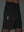 Detail of glow in the dark feature on black breathable running shorts with 4 zipper pockets