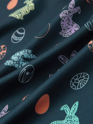 Close-up of easter bunny eggs performance print boys golf polo, showcasing texture and print details.