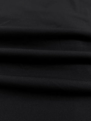 Close-up of lightweight breathable fabric texture, showing fine woven details, lightweight upf50+ short sleeve golf vests jacket in black