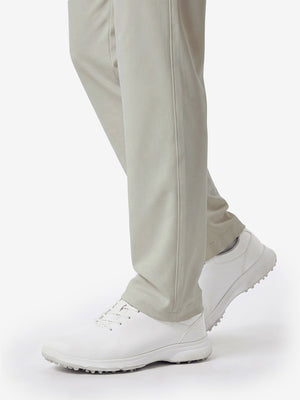 Detail view of hem and lower leg on silver grey women's regular fit stretchy golf pants