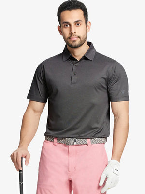 Model front half-body holding golf club wearing BLACK Performance Ananas Jacquard Polo