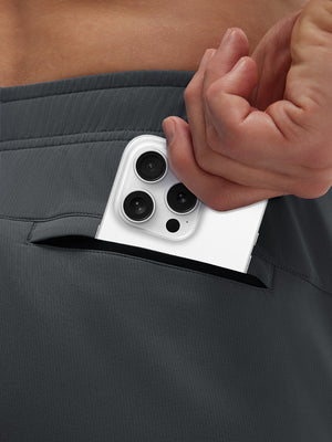 Back view of pocket on dark grey breathable running shorts with 4 zipper pockets