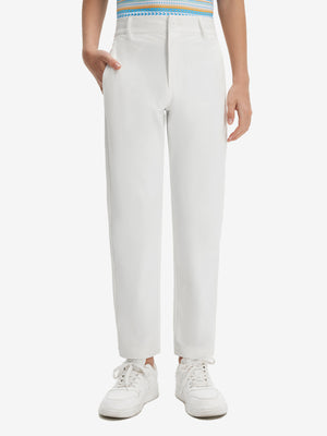 Front lower body shot of model wearing the white youth water resistant cotton blend golf pants, showcasing a relaxed fit