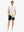 Full-body front view holding a takeaway drink cup, wearing WHITE WILD GOOSE Stylish Printing Summer Shirt.